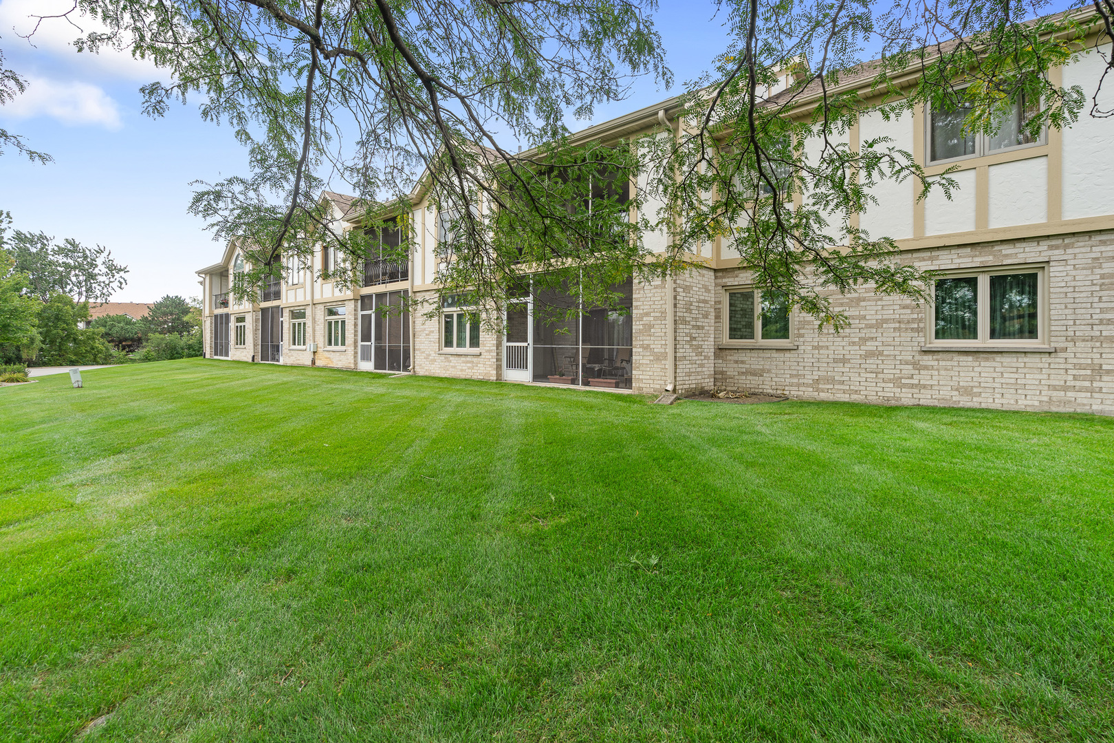 18431 Pine Cone Drive, Unit 1 Tinley Park, IL 60477 - Photo 25 of 33 a view of a yard in front of a house