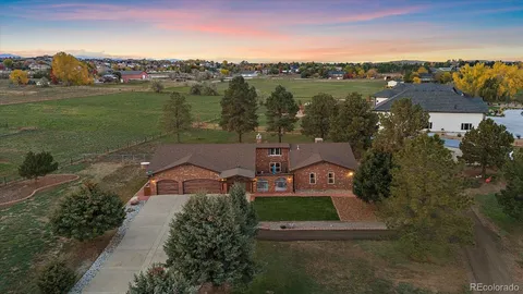 an aerial view of a house with outdoor space lake view and mountain view