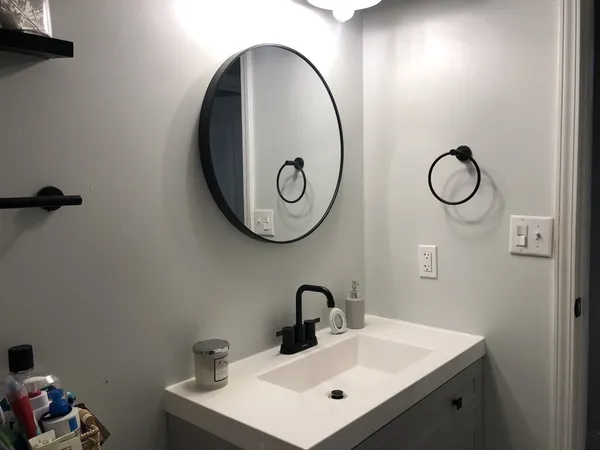 a bathroom with a sink and a mirror