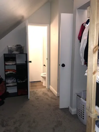 a view of a closet area with living room