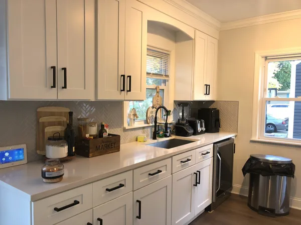 a kitchen with a sink and cabinets