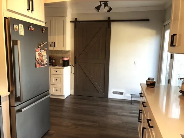 a kitchen with stainless steel appliances a refrigerator and a stove