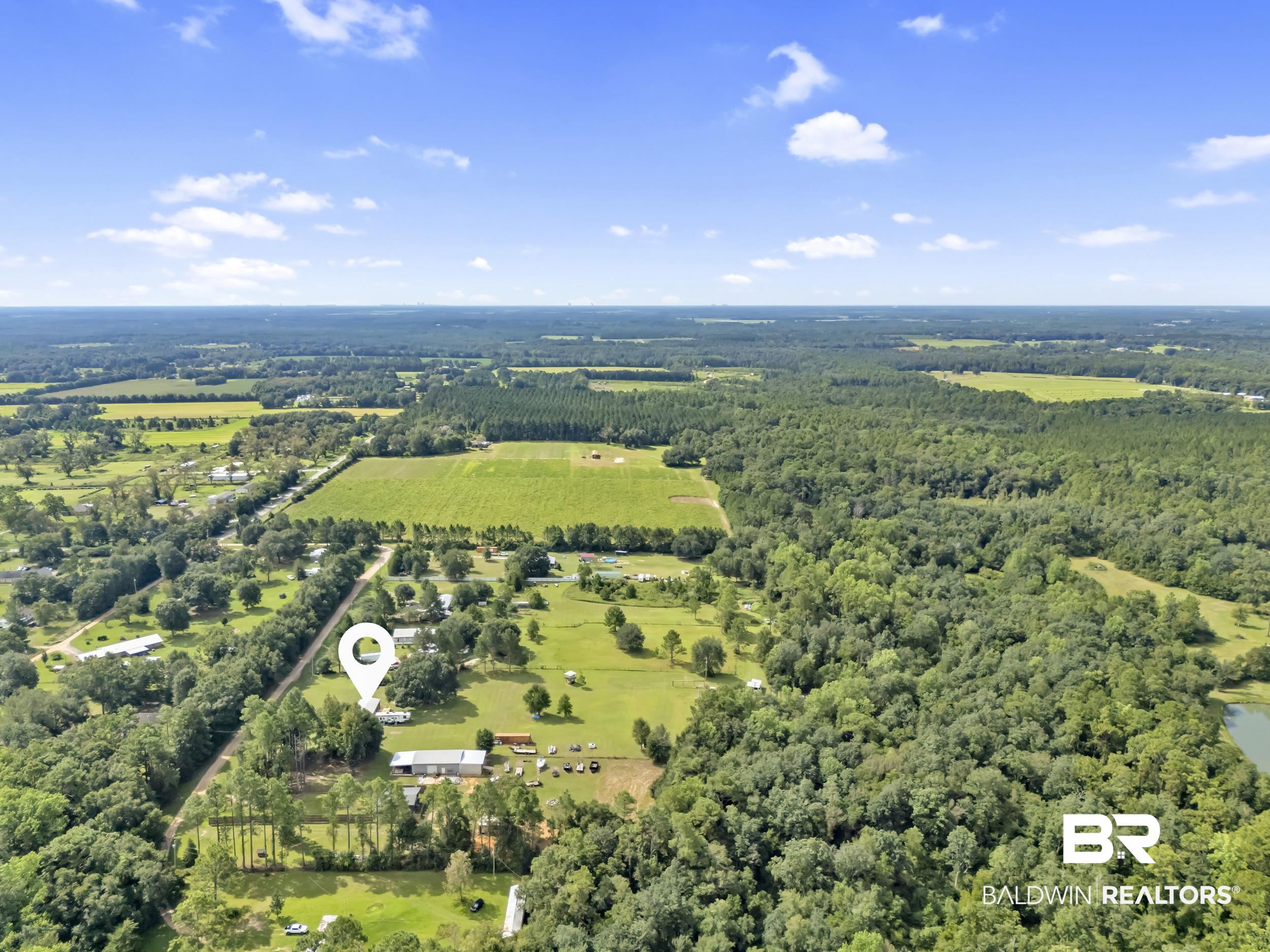 22823 Lanier Road Robertsdale, AL 36567 - Photo 10 of 46 Aerial view of property's location featuring rural landscape