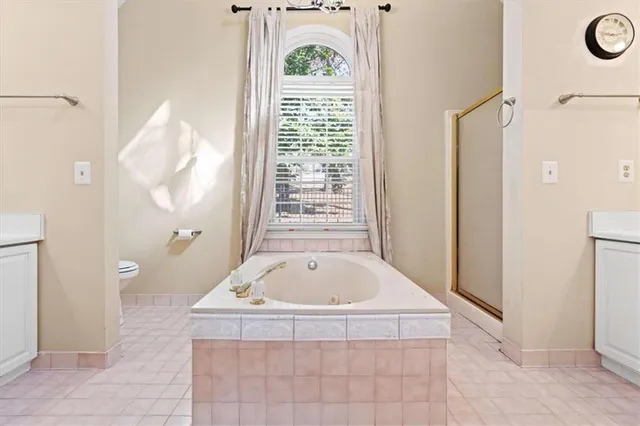 a living room with a baby crib furniture and a window