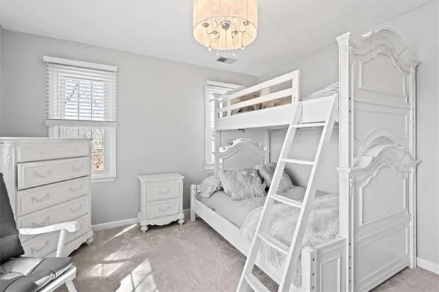 a view of a backyard with table and chairs under an umbrella