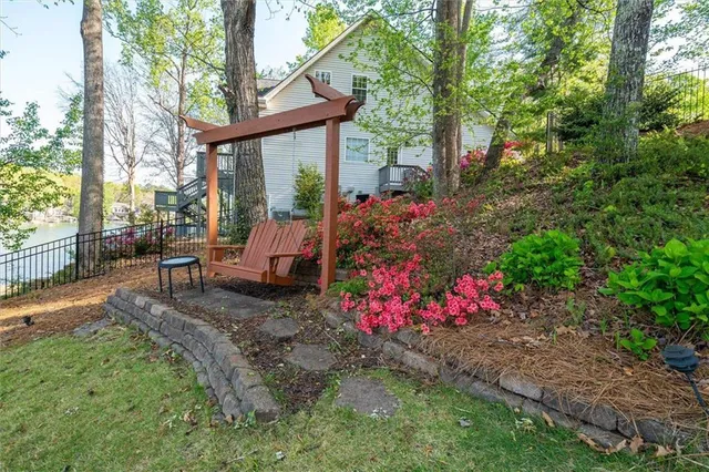 a front view of a house with a yard and porch