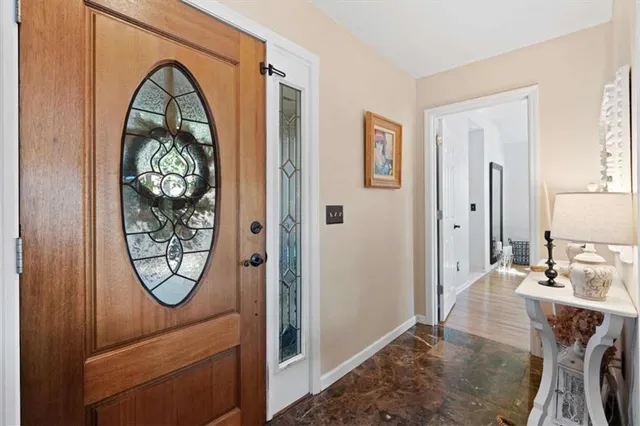 a living room with furniture fireplace and a flat screen tv