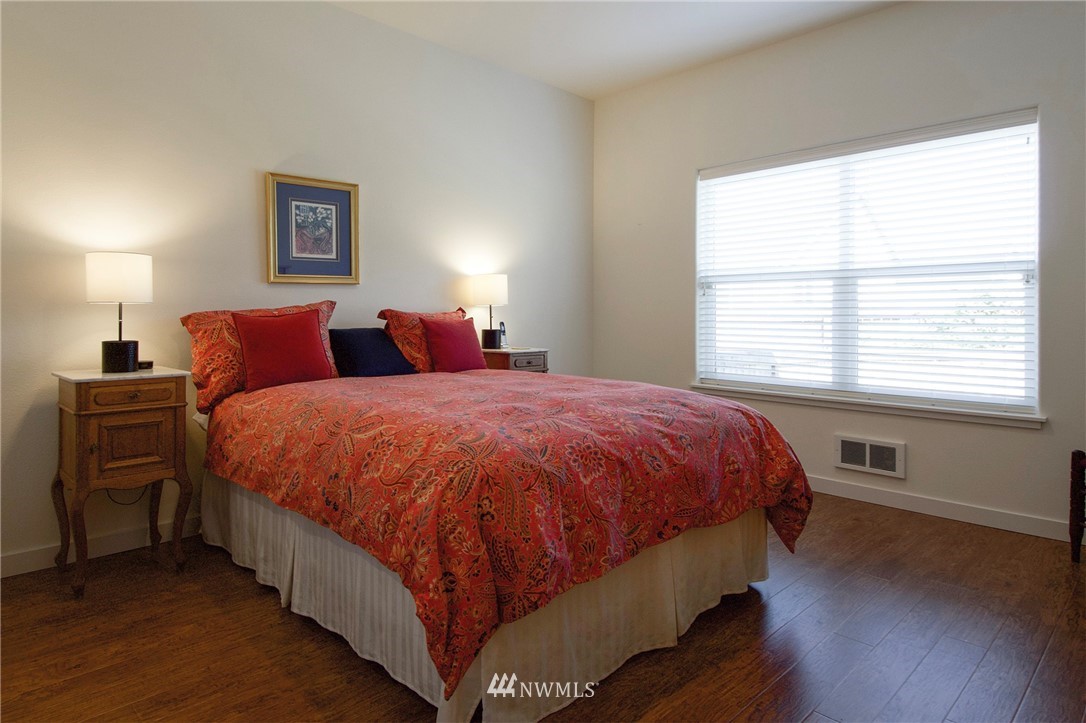 161 Stratus Loop Sequim, WA 98382 - Photo 18 of 34 a spacious bedroom with a bed and a window