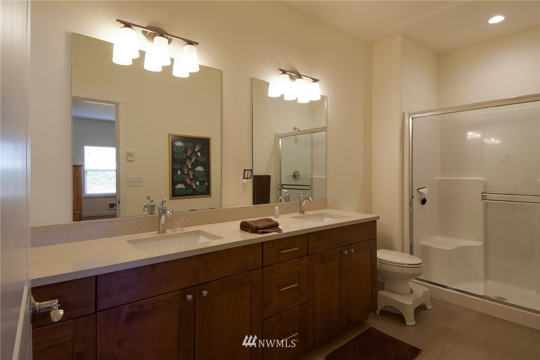 161 Stratus Loop Sequim, WA 98382 - Photo 22 of 34 a bathroom with a double vanity sink mirror and toilet