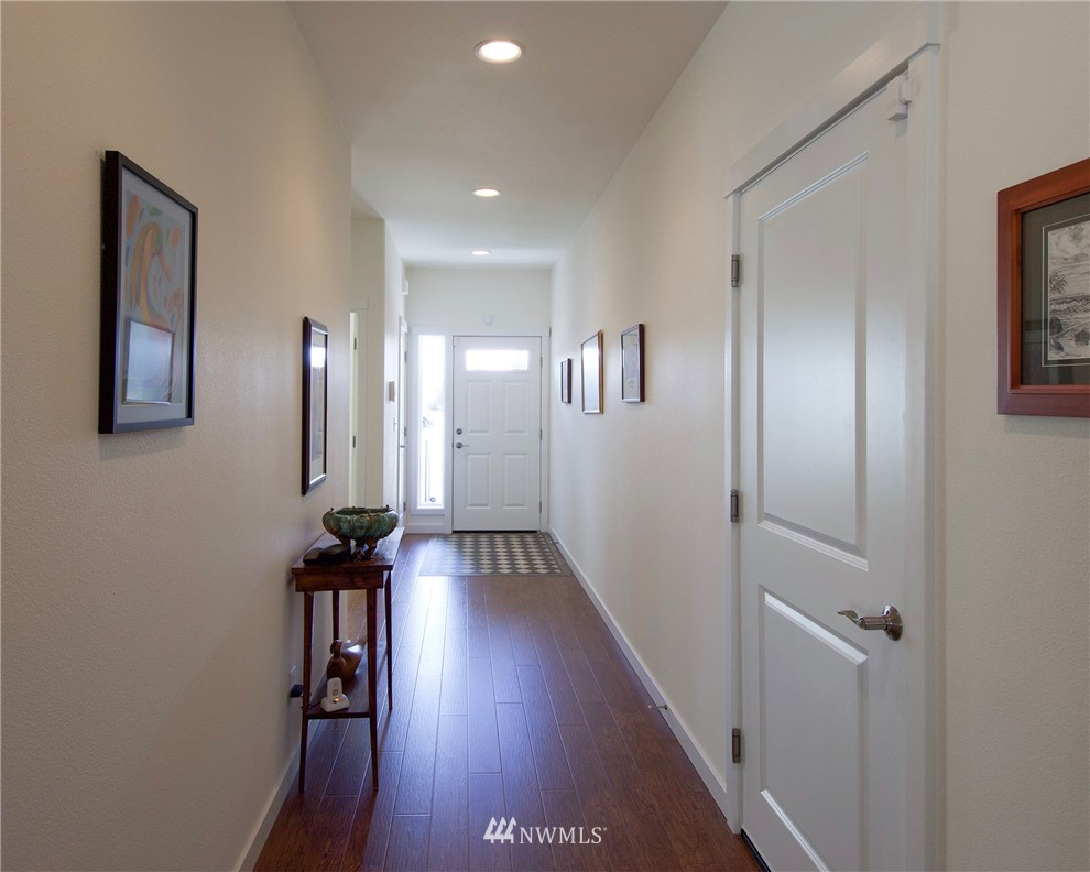 161 Stratus Loop Sequim, WA 98382 - Photo 24 of 34 a view of hallway with furniture and wooden floor