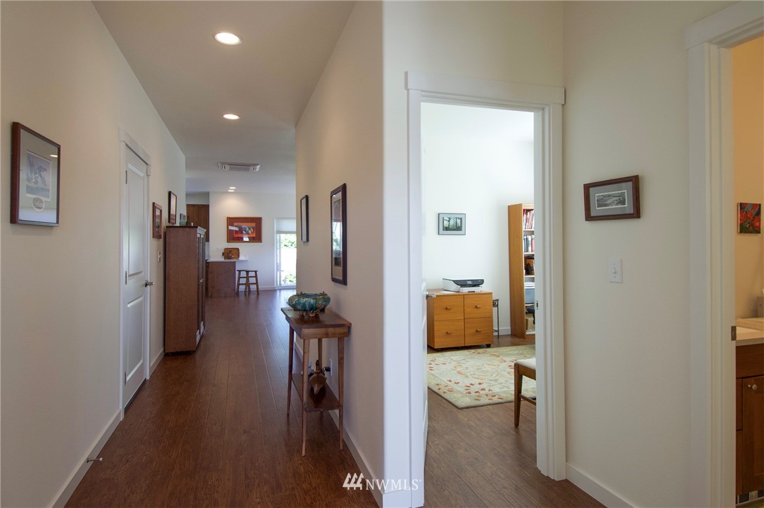 161 Stratus Loop Sequim, WA 98382 - Photo 31 of 34 a hallway with a couch and a view of bathroom