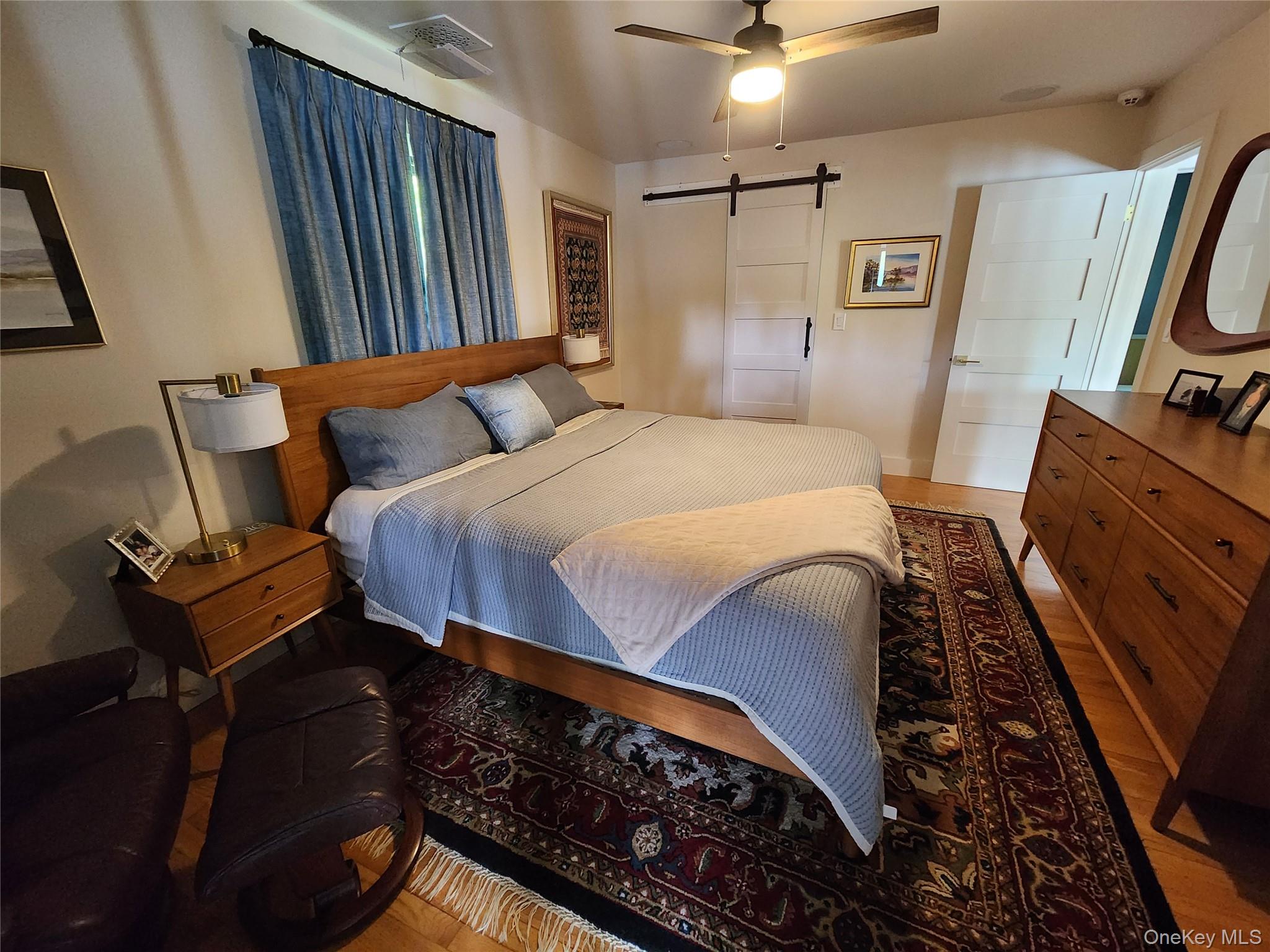 53 Lake Pleasant Road Staatsburg, NY 12580 - Photo 18 of 34 a bedroom with a bed and a mirror on the dresser