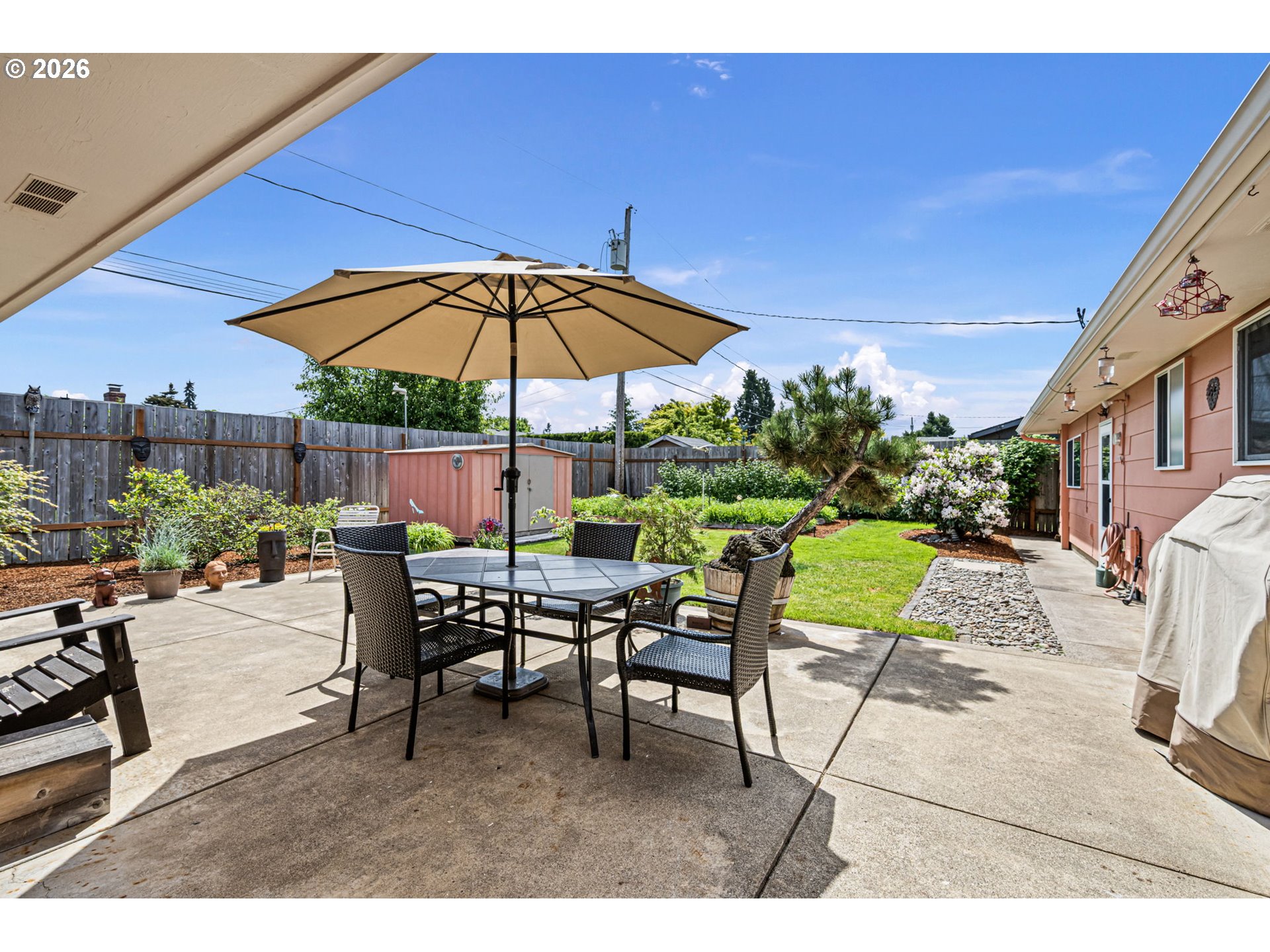 2465 17th Street Springfield, OR 97477 - Photo 40 of 47 a view of a backyard with a patio and outdoor seating