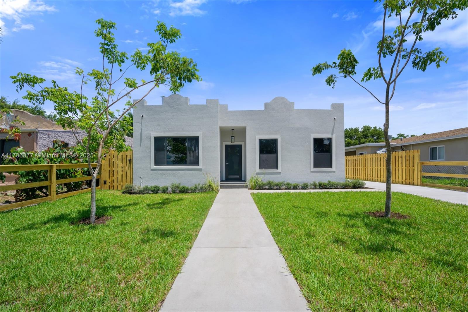 619 35th Street West Palm Beach, FL 33407 - Photo 1 of 25 a front view of house with yard