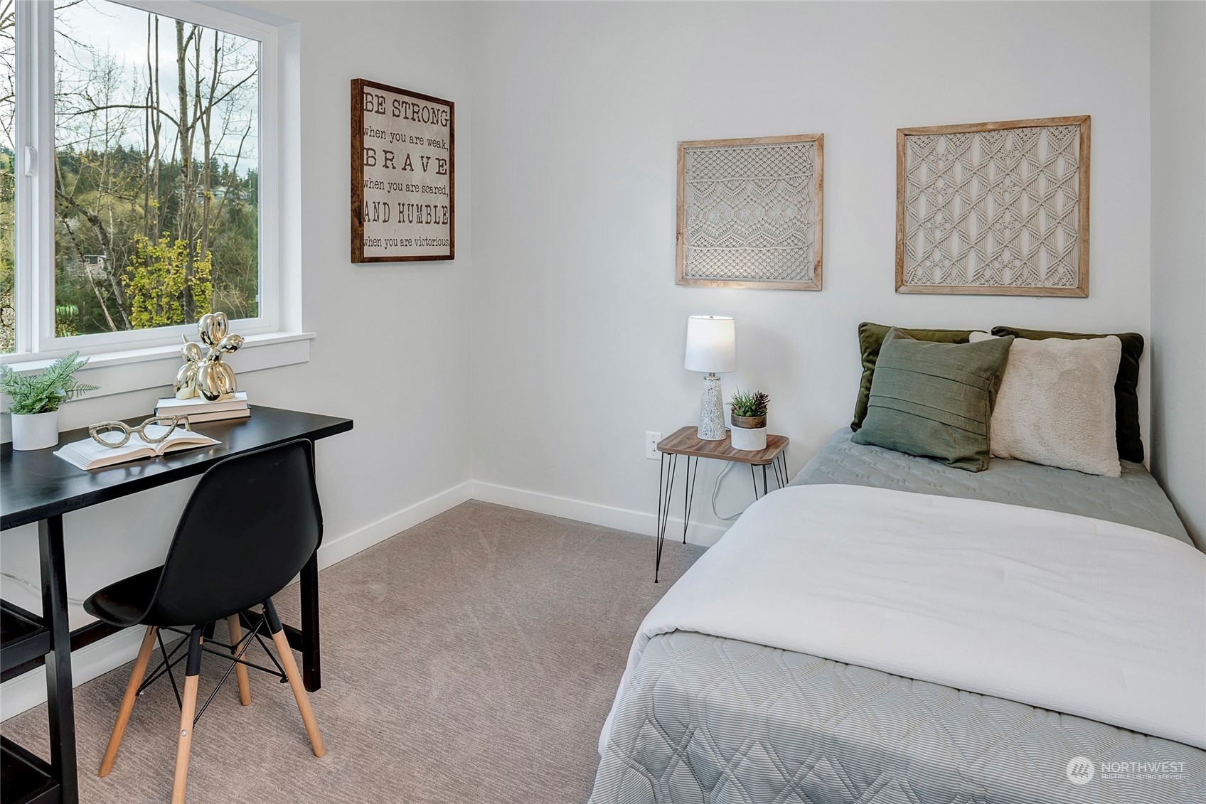 8911 Northeast 173rd Place, Unit A Bothell, WA 98011 - Photo 30 of 34 a bedroom with a bed and a table in it