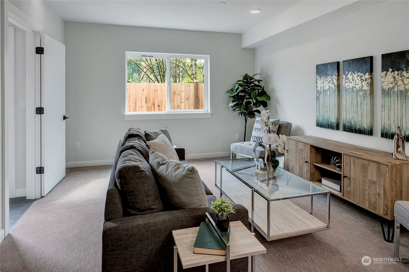 8911 Northeast 173rd Place, Unit A Bothell, WA 98011 - Photo 32 of 34 a living room with furniture and a window