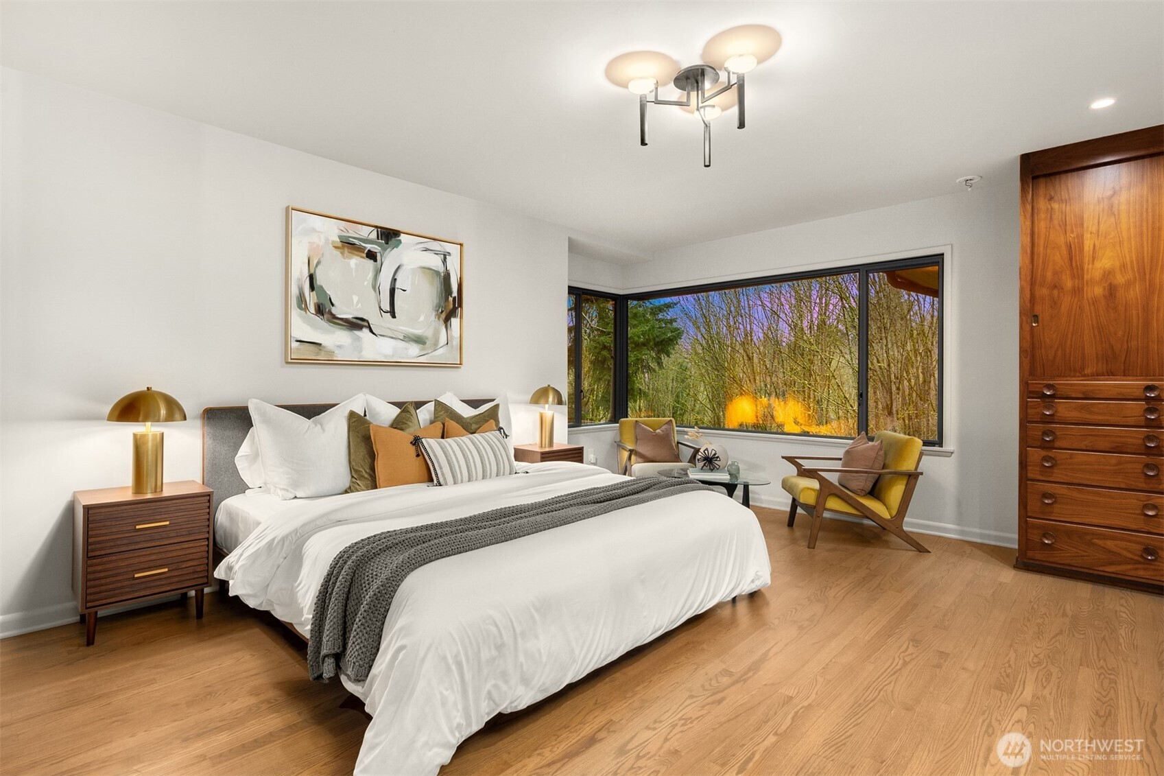 13739 Northwood Road Northwest Seattle, WA 98177 - Photo 17 of 35 a bedroom with bed and a chandelier