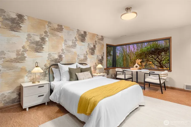 a bedroom with a bed and a dresser