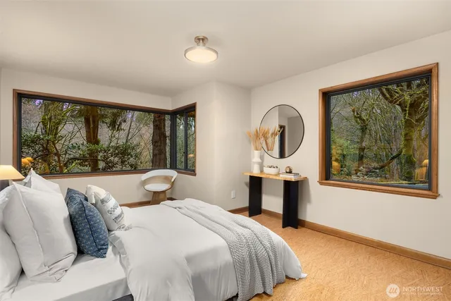 a bathroom with a sink mirror and shower