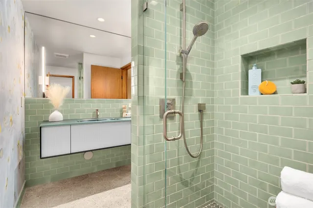 a living room with furniture and floor to ceiling window