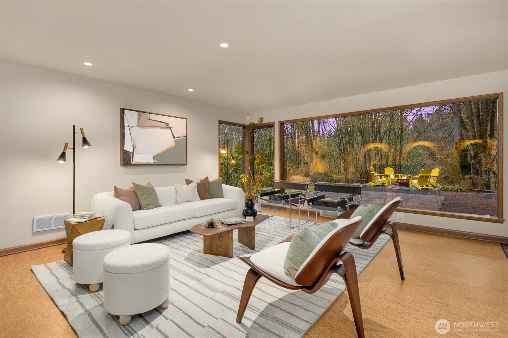 13739 Northwood Road Northwest Seattle, WA 98177 - Photo 28 of 35 a living room with couches a coffee table and a flat screen tv with wooden floor