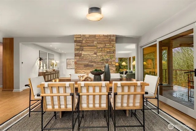 a dining room with furniture and wooden floor
