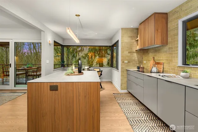 a kitchen with a table chairs and a refrigerator