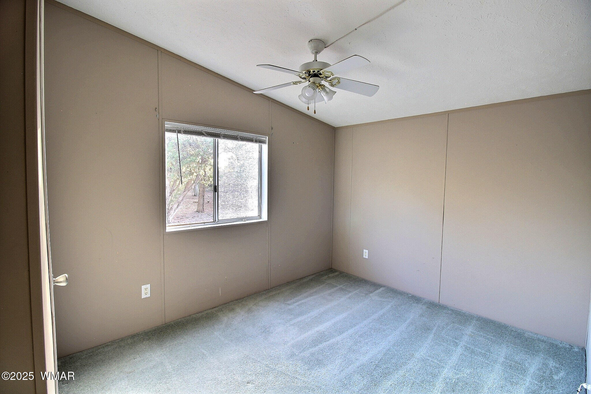 7803 Stokes Lane Show Low, AZ 85901 - Photo 11 of 25 a view of an empty room with a window