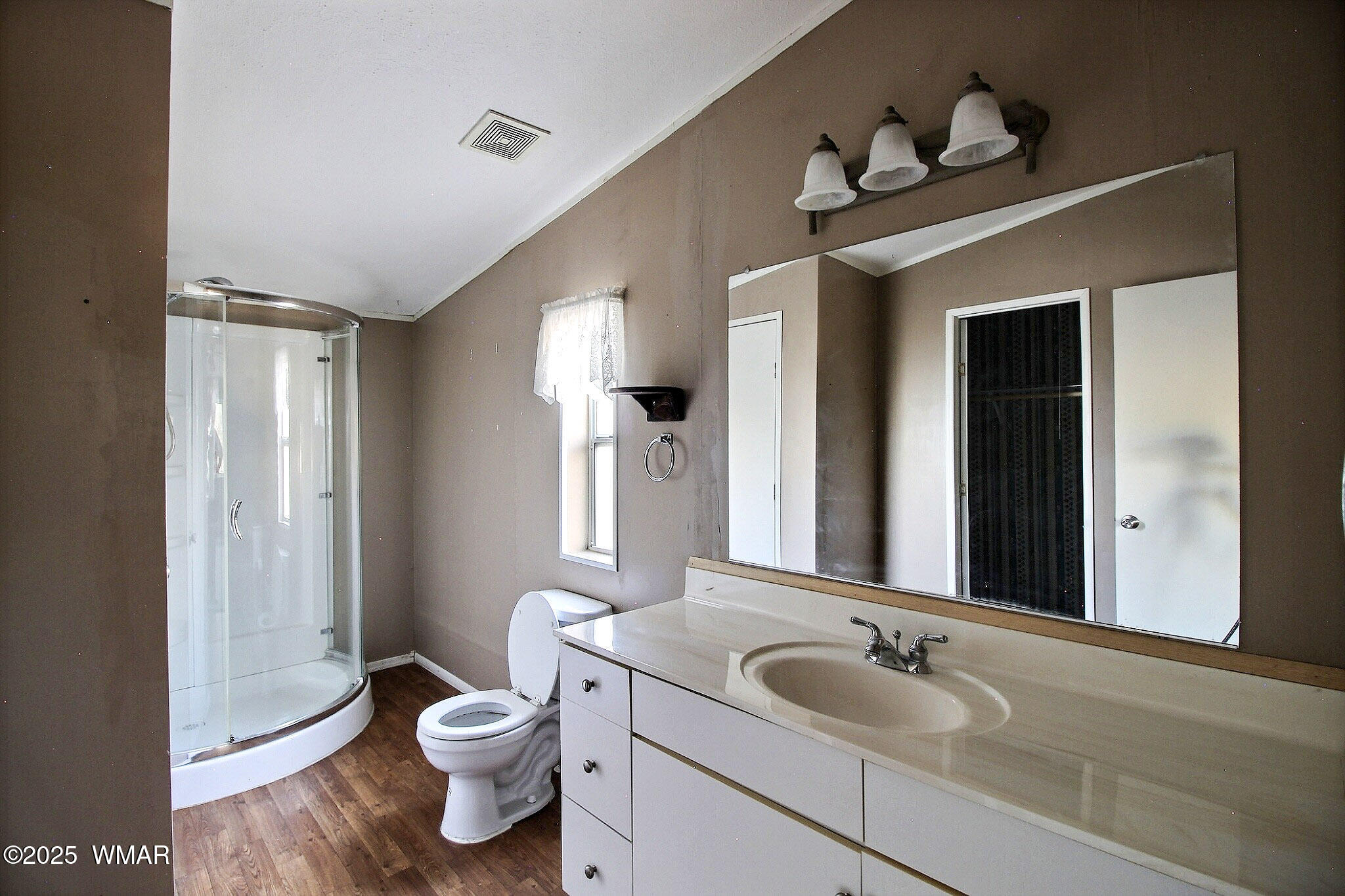 7803 Stokes Lane Show Low, AZ 85901 - Photo 13 of 25 a bathroom with a granite countertop sink toilet and mirror
