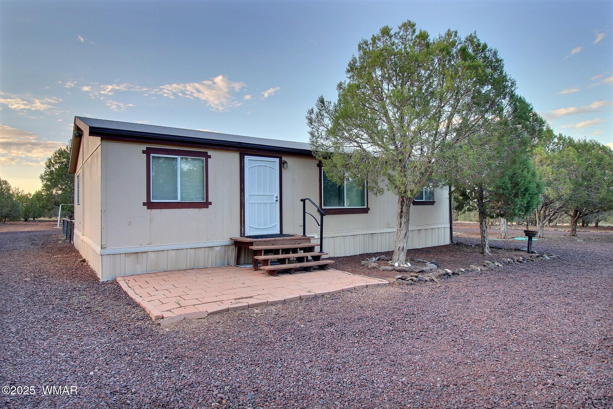 7803 Stokes Lane Show Low, AZ 85901 - Photo 14 of 25 a view of a house with backyard and a tree