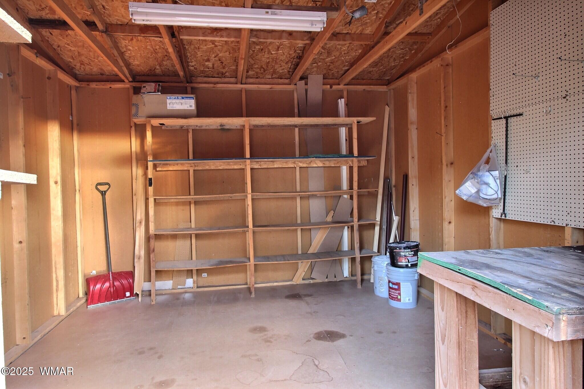 7803 Stokes Lane Show Low, AZ 85901 - Photo 16 of 25 a view of a room with wooden shelves