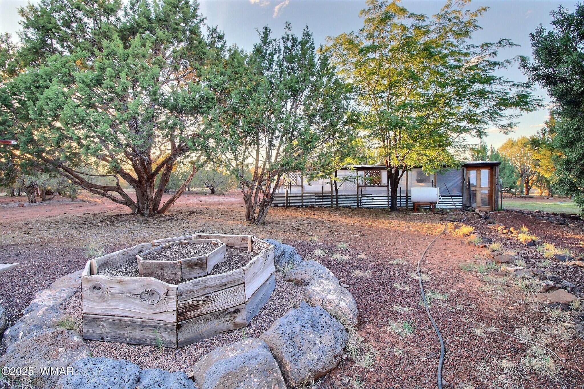 7803 Stokes Lane Show Low, AZ 85901 - Photo 21 of 25 a view of a house with yard and tree s