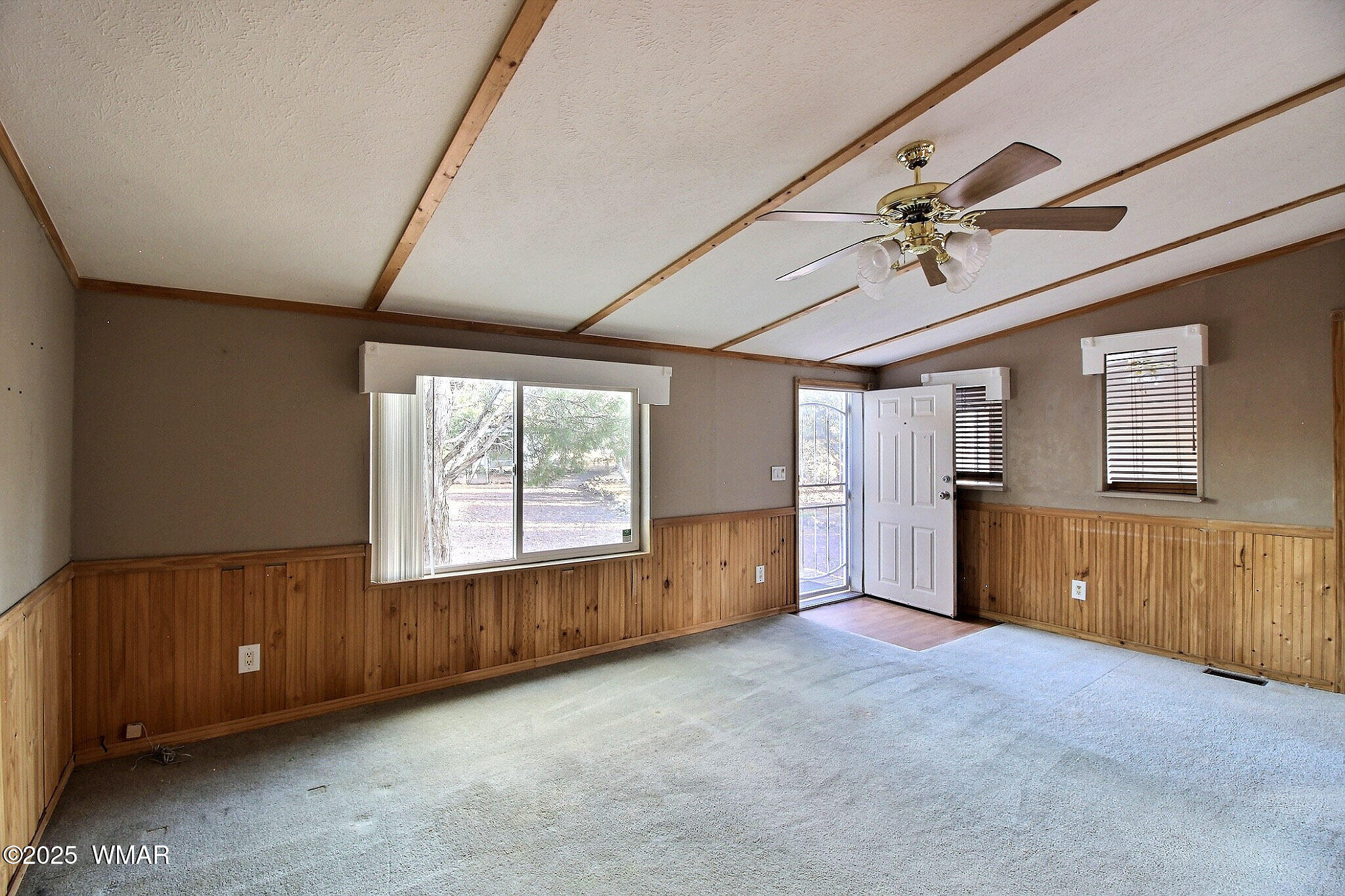 7803 Stokes Lane Show Low, AZ 85901 - Photo 3 of 25 a big room with windows and closet