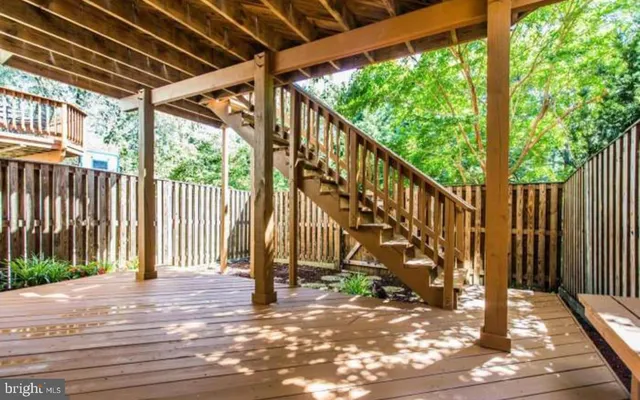 a view of outdoor space with deck and wooden floor