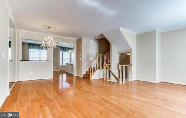 a view of empty room and wooden floor