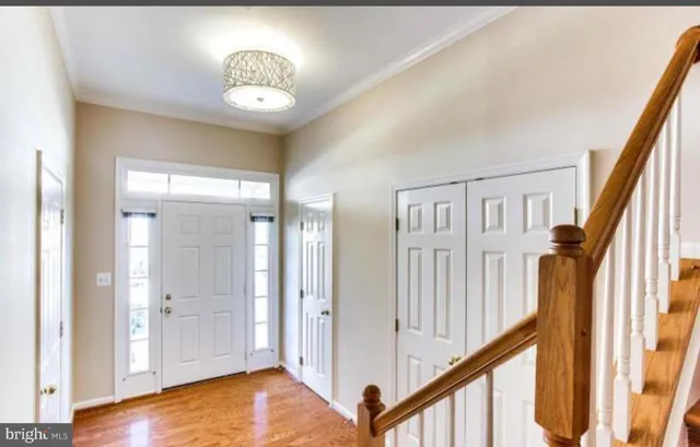 a view of an entryway with wooden floor