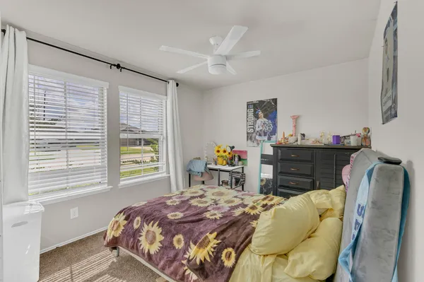 a bedroom with a bed and furniture