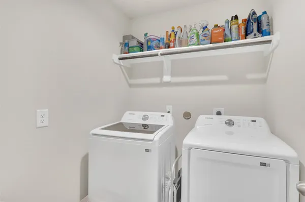 a utility room with dryer and washer