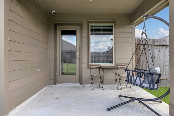 a view of staircase with a rug and a window