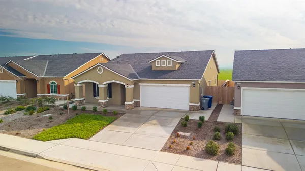 a view of house with yard and entertaining space