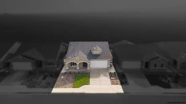 a kitchen with a table chairs refrigerator and microwave