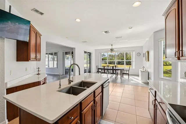 a kitchen with counter top space a sink cabinets and appliances