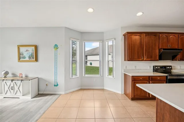 a kitchen with stainless steel appliances a stove sink and cabinets