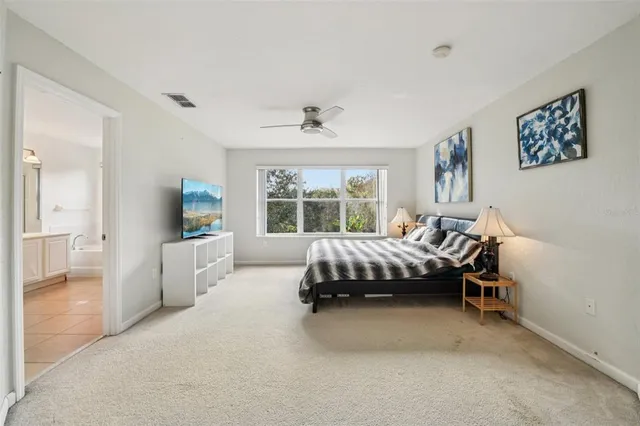 a bed room with a bed and a chair