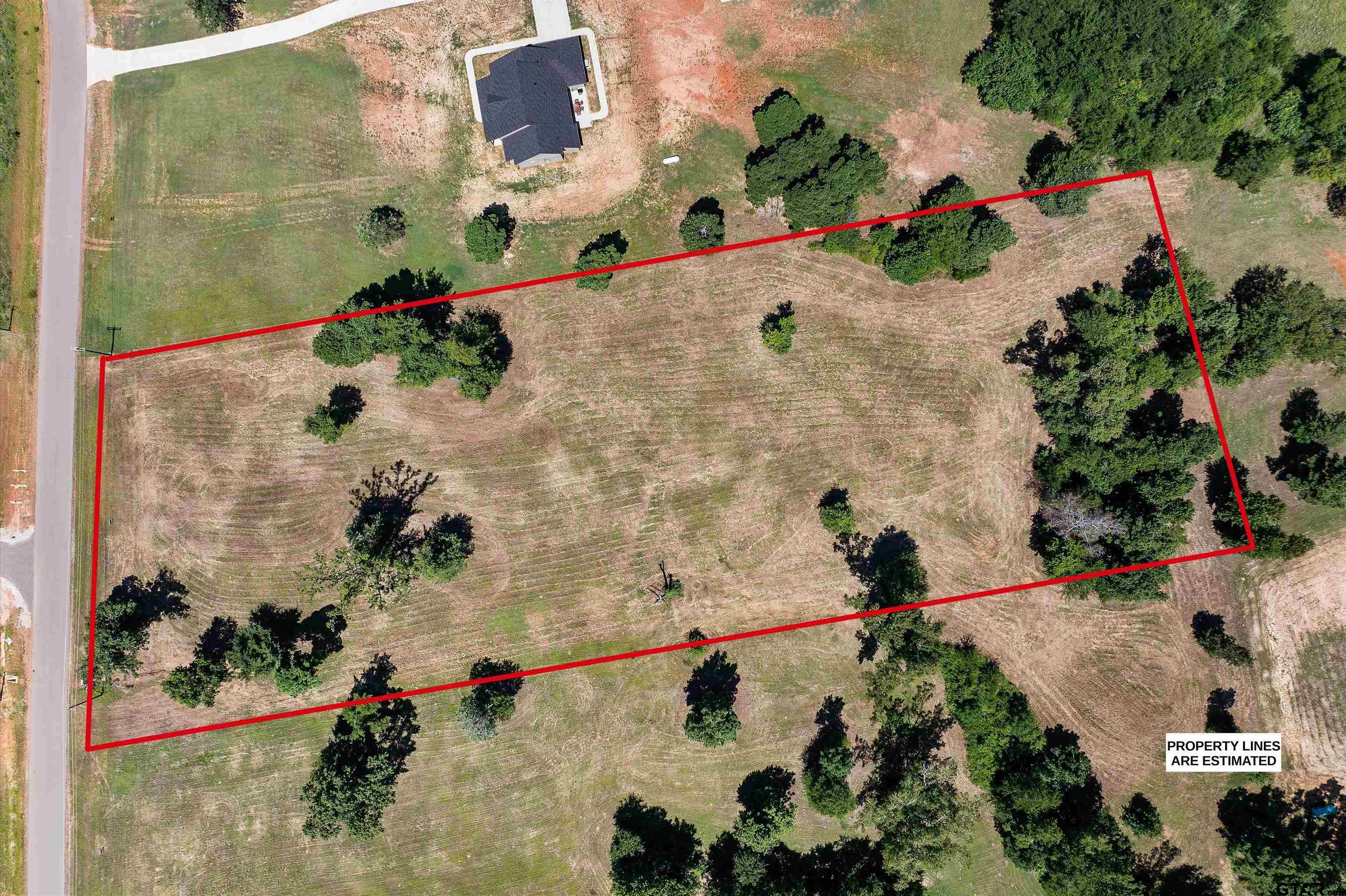 Tbd Tbd Ridgeline Loop Winona, TX 75792 - Photo 6 of 9 an aerial view of a house with a yard