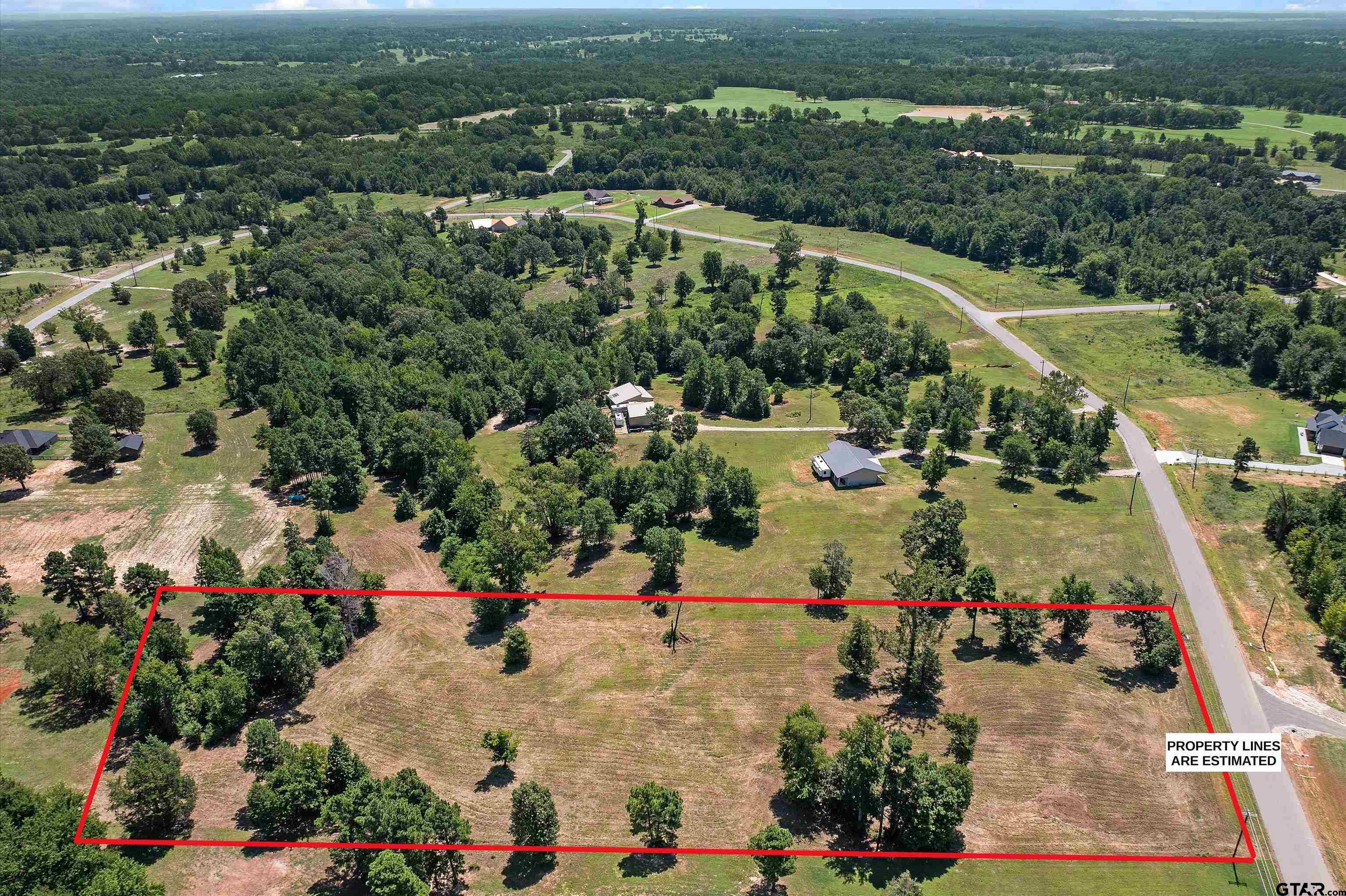 Tbd Tbd Ridgeline Loop Winona, TX 75792 - Photo 8 of 9 an aerial view of a house with a yard
