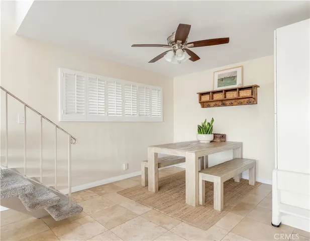 a workspace with a table and chairs