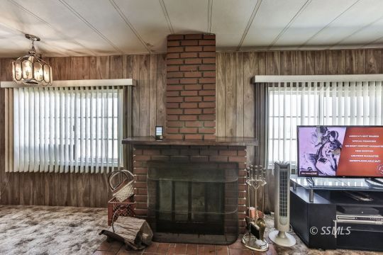 1975 East Burns Avenue Ridgecrest, CA 93555 - Photo 2 of 43 a living room with furniture and a fireplace
