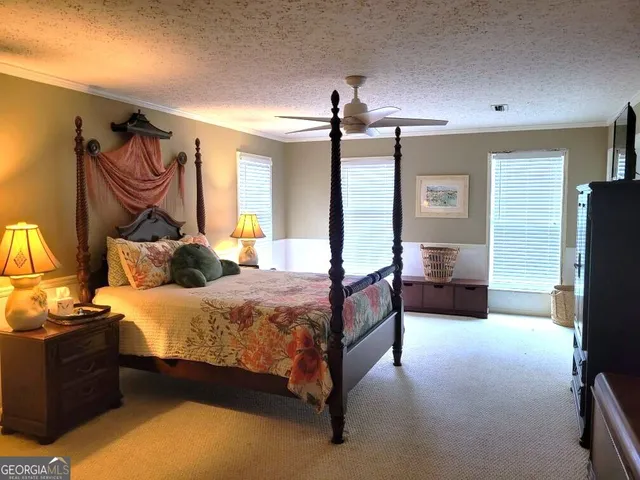 a bed room with a bed and a television