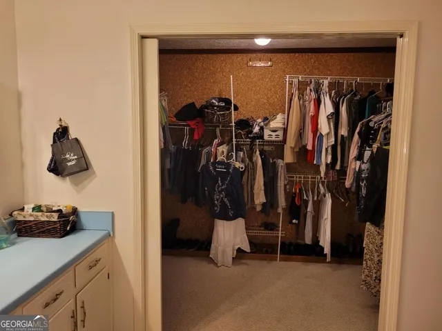 a bedroom with bed and window